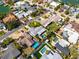 Aerial view of the property showcasing the pool, landscaping, and location in the neighborhood at 230 S Julia Cir, St Pete Beach, FL 33706