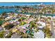 Breathtaking aerial shot of a coastal neighborhood featuring homes with pools near the water at 230 S Julia Cir, St Pete Beach, FL 33706