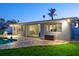 Home exterior view showcasing the pool, patio and sliding glass doors at 230 Julia S Cir, St Pete Beach, FL 33706