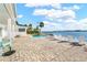 Inviting pool area with comfortable lounge chairs and serene waterfront views, ideal for relaxation at 2630 W Bay Isle Se Dr, St Petersburg, FL 33705