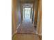 Hallway leading into the house with carpeting and tile flooring at 2827 Shetland Ridge Dr, Valrico, FL 33596