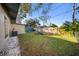 Grassy backyard with a shed and a fire pit at 2905 Bay St, Sarasota, FL 34237