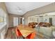 Inviting dining area with views into the living room, wood-look floors, and a ceiling fan at 2905 Bay St, Sarasota, FL 34237