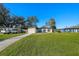 Landscaped single-Gathering home showcasing its well-maintained lawn, lengthy driveway and inviting curb appeal at 2905 Bay St, Sarasota, FL 34237