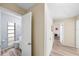 Bright hallway leading to bedroom and bathroom with modern wood-look vinyl flooring at 2905 Bay St, Sarasota, FL 34237