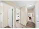 Hallway connecting to bedroom and living room with modern flooring and neutral walls at 2905 Bay St, Sarasota, FL 34237