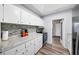 Bright kitchen featuring granite countertops, subway tile backsplash, and modern appliances at 2905 Bay St, Sarasota, FL 34237