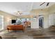 Open-concept living room with stylish flooring, bright lighting, and a seamless flow to the dining area at 2905 Bay St, Sarasota, FL 34237