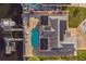 Aerial view of house with backyard pool, solar panels, and dock with canal access to the Gulf at 3939 Rudder Way, New Port Richey, FL 34652