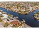 Stunning waterfront residences with private docks and solar panels on a sunny day at 3939 Rudder Way, New Port Richey, FL 34652