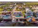 Overhead aerial view of houses with backyard pools, waterfront access, and boat docks on the canals at 3939 Rudder Way, New Port Richey, FL 34652