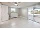 Bright bedroom with ceiling fan, neutral walls, and sliding door to patio at 3939 Rudder Way, New Port Richey, FL 34652