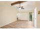 Bright bedroom features wood floors, a beam ceiling, and a ceiling fan at 4307 Woodmans Chart # 132, Sarasota, FL 34235