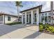 Modern community center featuring white pillars, large windows, and manicured landscaping at 4307 Woodmans Chart # 132, Sarasota, FL 34235