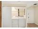 Convenient laundry area featuring a washer, dryer, and storage shelves at 4307 Woodmans Chart # 132, Sarasota, FL 34235