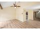 Bright living room with plank flooring, vaulted ceiling, and a seamless flow to other areas at 4307 Woodmans Chart # 132, Sarasota, FL 34235