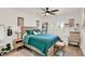 Bright bedroom boasts a rustic wood bed and decor with a soft rug at 4309 Deepwater Ln, Tampa, FL 33615