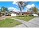 Charming single-story home featuring a manicured lawn and beautiful brick driveway at 4309 Deepwater Ln, Tampa, FL 33615