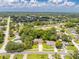 Overhead view of a house with a long driveway and mature landscaping in a quiet neighborhood at 5147 Elwood Rd, Spring Hill, FL 34608