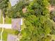 Aerial view of the home showcasing the lush, mature trees surrounding the home at 5147 Elwood Rd, Spring Hill, FL 34608