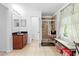 Bright bathroom featuring a walk-in shower and a vanity with double mirrors at 5147 Elwood Rd, Spring Hill, FL 34608