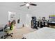 Bright bedroom with ample storage and workspace, featuring fun arcade game decor at 5147 Elwood Rd, Spring Hill, FL 34608