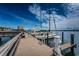 Boat dock showcases multiple slips for sailboats and powerboats, on a sunny day with clear blue skies at 5200 Brittany S Dr # 902, St Petersburg, FL 33715