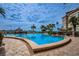 Stunning outdoor pool with city views and palm trees at 5200 Brittany S Dr # 902, St Petersburg, FL 33715