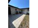 Tiled back patio featuring a grill, and sliding glass door at 5202 Cumberland Dr, Tampa, FL 33617