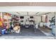 Garage with exercise equipment, storage, and washing machine at 5202 Cumberland Dr, Tampa, FL 33617