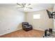 Cozy living room features a ceiling fan, recliner, and mounted television at 5202 Cumberland Dr, Tampa, FL 33617