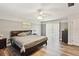 Main bedroom featuring hardwood floors and ample natural light from sliding glass doors at 5202 Cumberland Dr, Tampa, FL 33617