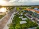 Inviting outdoor park featuring chessboards, seating, and lush landscaping by the waterfront at 5202 Cumberland Dr, Tampa, FL 33617