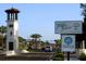 Scenic view of Temple Terrace with its iconic tower, lush greenery, and welcoming signage at 5202 Cumberland Dr, Tampa, FL 33617