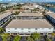 Aerial view of a condo complex with garages and docks at 521 Pinellas Bayway S # 104, St Petersburg, FL 33715