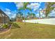 Large backyard with a pool, shed, and a tall palm tree at 5327 N Cranberry Blvd, North Port, FL 34286