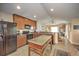 Functional kitchen featuring a center island, black appliances, and open layout design at 5327 N Cranberry Blvd, North Port, FL 34286