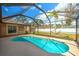 Bright pool area, completely screened, with a tranquil backyard view at 5327 N Cranberry Blvd, North Port, FL 34286