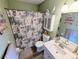 Bathroom featuring beach themed decor, a white vanity, and a toilet at 5973 Terrace Park N Dr # 301, St Petersburg, FL 33709