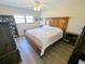 Bedroom with a wood bed frame and a ceiling fan at 5973 Terrace Park N Dr # 301, St Petersburg, FL 33709