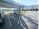 Exterior shot of carport, featuring covered parking with surrounding community buildings at 5973 Terrace Park N Dr # 301, St Petersburg, FL 33709