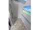 Clean elevator interior with beach art, stainless steel details and gray floors at 5973 Terrace Park N Dr # 301, St Petersburg, FL 33709