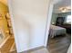 Hallway view with a peek into the bedroom, showing a bed and bookcase at 5973 Terrace Park N Dr # 301, St Petersburg, FL 33709