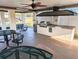 Outdoor grilling area with BBQ grill, countertop, tables and seating, perfect for community gatherings at 5973 Terrace Park N Dr # 301, St Petersburg, FL 33709