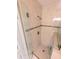 Modern shower with glass door and tiled walls at 5973 Terrace Park N Dr # 301, St Petersburg, FL 33709