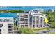 An aerial view showcases the building with multiple balconies at 6 Belleview Blvd # 203, Belleair, FL 33756