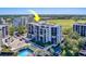 An aerial view showcases building and landscaping at 6 Belleview Blvd # 203, Belleair, FL 33756