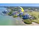 Overhead view of waterfront condos, marina, and pool, highlighting community amenities and waterfront location at 6 Belleview Blvd # 203, Belleair, FL 33756