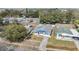 Aerial view of cozy home with fenced yard and nearby neighborhood at 6303 Central Ave, New Port Richey, FL 34653