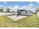 Backyard with concrete patio and covered patio structure with seating, ready for outdoor enjoyment at 6303 Central Ave, New Port Richey, FL 34653